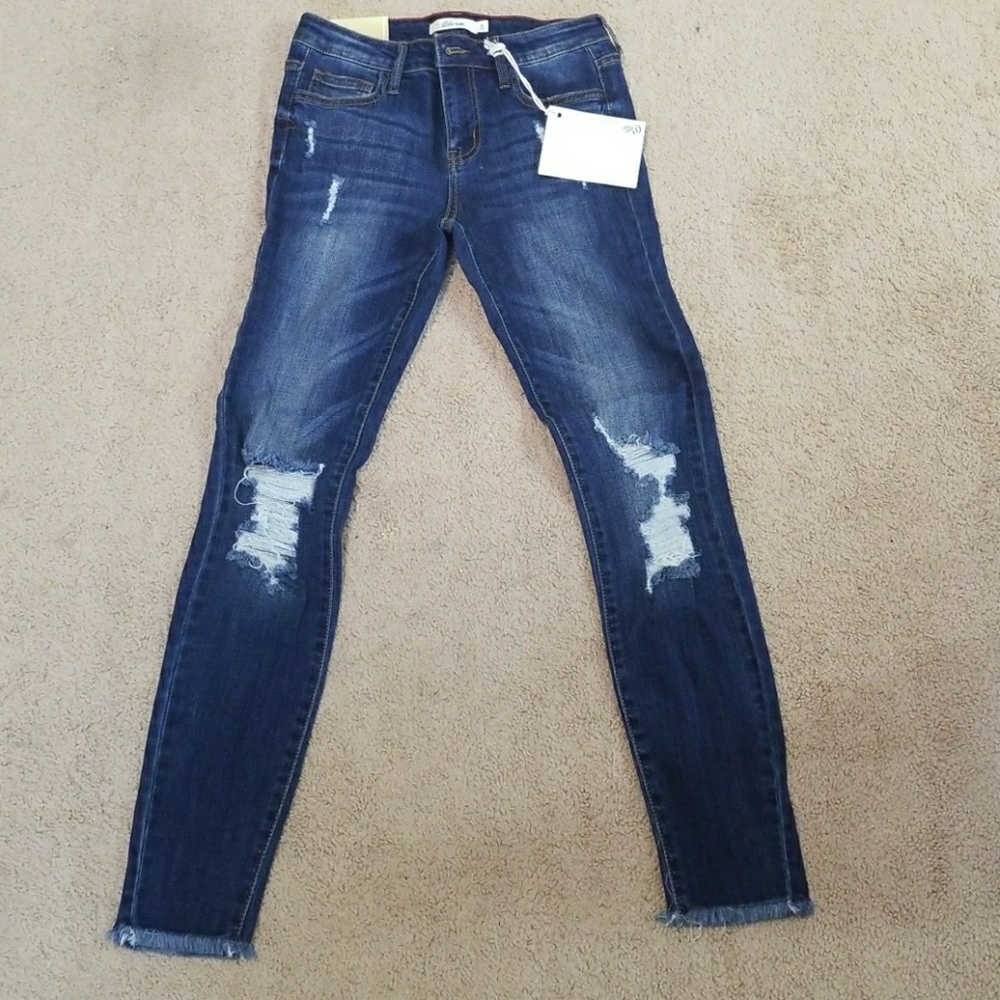 Dark denim with ripped knees